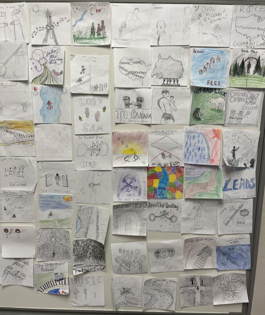 A collage of student drawings expressing themes of freedom, hope, and music, displayed on a wall.
