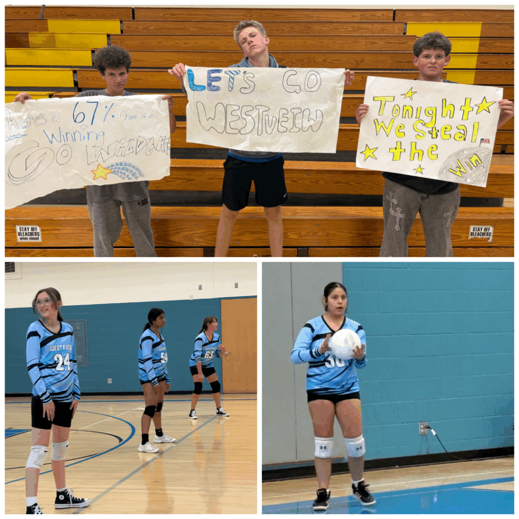 Students cheer for their volleyball team, holding signs, while players prepare on the court for the game.